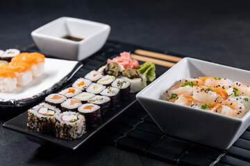 Various dishes of Asian cuisine with typical sushi