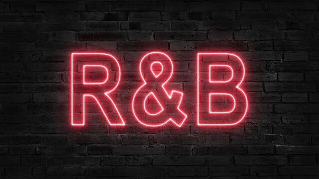 Neon glowing word 'R and B' on a black brick wall background with reflections on a floor. Neon glow signs in seamless loop motion graphic. 4K.