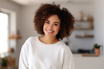 A happy plus size,  african woman, she is wearing a plain white mockup unisex sweatshirt showcasing, brazilian woman at home