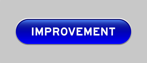 Blue color capsule shape button with word improvement on gray background