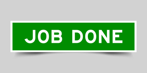 Green color square shape sticker label with word job done on gray background