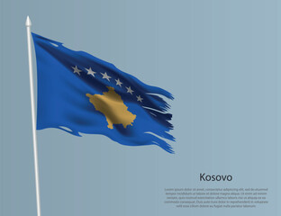 Ragged national flag of Kosovo. Wavy torn fabric on blue background