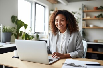 Fototapeta premium smiling freelance businesswoman working with laptop tabley while stay in cafe coffeeshop portrait shot of smiling young adult woman casual cloth daylight interior background