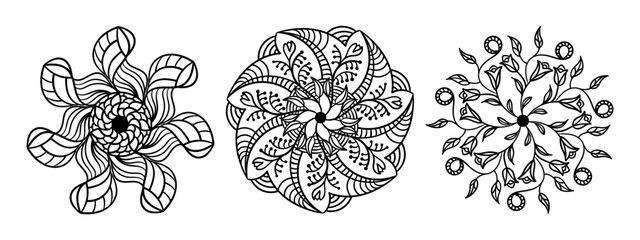 Three circular ornaments. Ethnic black and white floral patterns. Mandala. 
