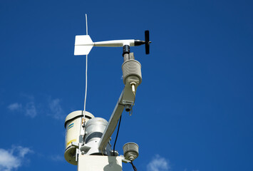 White weather station against a blue sky, meteorology