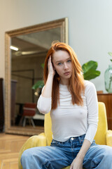 portrait of a young beautiful woman with red hair in  studio