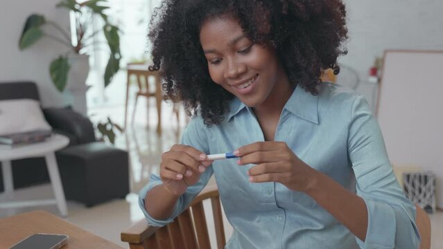 Happy African Woman Celebrating Positive Pregnancy Test Result