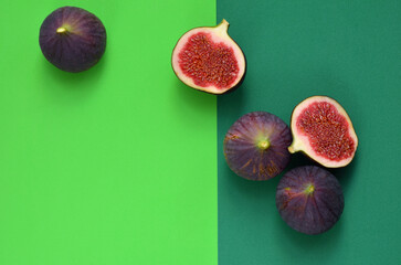 ripe fig fruits on colorful green flat lay background
