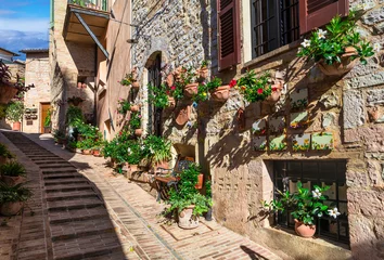 Gordijnen Traditional old villages of Italy, Umbria - beautiful Spello town. Charming floral streets decoration © Freesurf