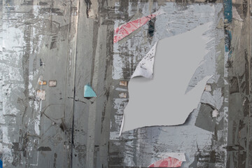 Messy notice board or wall with remains of notes and posters, with copy space in middle