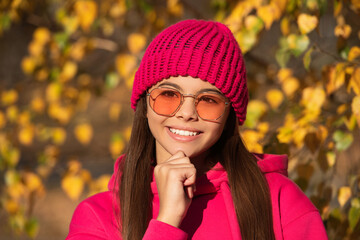 teen girl has trendy sunglasses. autumn fashion girl. trendy and stylish tween girl outdoor. fall fashion style for teen. outfit for the fall style. stylish girl in autumn