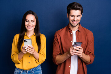 Portrait of cheerful people beaming smile use apple iphone gadget chatting typing post isolated on...