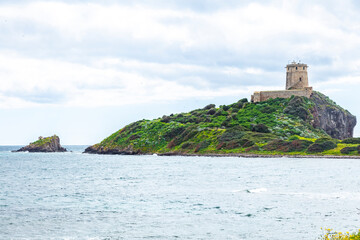lighthouse on the shore of the island, Sardinia, Italy