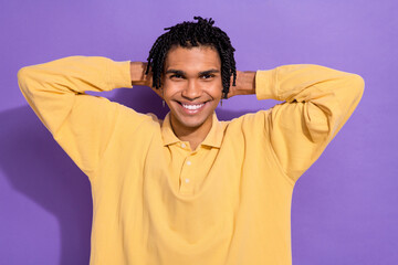 Photo of toothy beaming positive person with cornrows wear stylish shirt holding arms behind head...