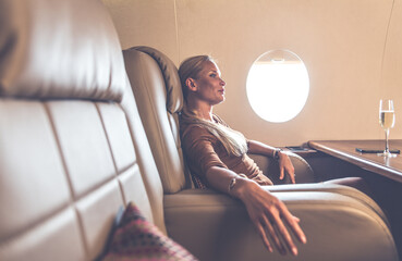 Beautiful woman traveling on her jet