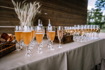 Many glasses of champagne on table