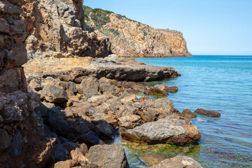 stone cliff on the seashore, Italy, Sardinia