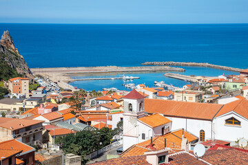 view from the top of the hill onto a beautiful and picturesque town Buggerru, Sardinia, Italy lying on the seashore of Mediterranean sea