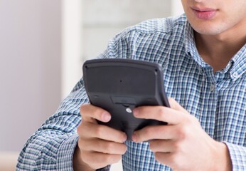 Young couple looking at family finance papers