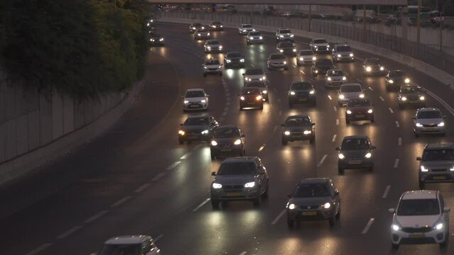 Tel Aviv, Israel : Cars  on Traffic load Driving In Jam On Ayalon  Freeway In Tel Aviv. Lighting reflection.