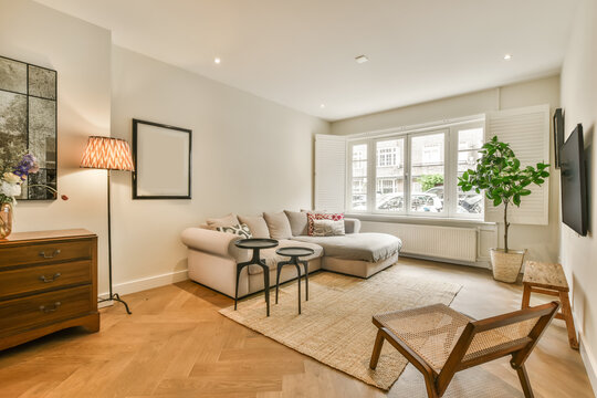 Modern living room with furniture by window