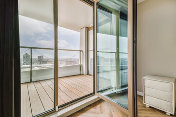 Empty balcony seen through open doors
