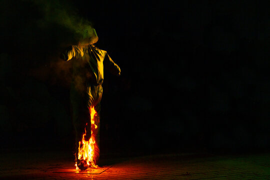 Scarecrow burning on a dark and gloomy