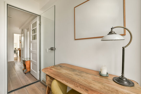 Interior Of House With Desk And Picture Frame On Wall