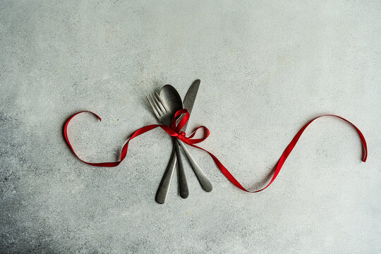 Vintage cutlery set on gray surface