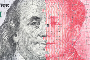 A complex jigsaw puzzle featuring faces of Benjamin Franklin and Mao Zedong symbolizes the...