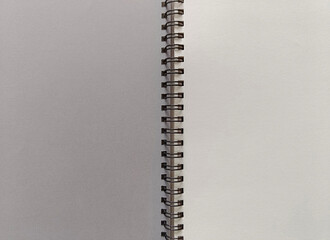 Open notebook on a spring. A clean white sheet, a place for writing.