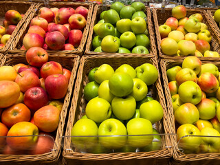 Apples in wicker baskets on a store counter. Apples close-up.