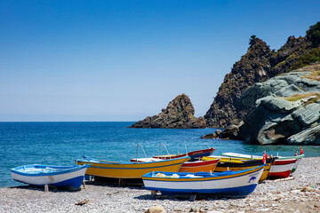 Beautiful photo of beached Fishing Canoe, the canoe is painted colorful in traditional asian...