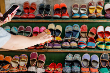 homemade children's leather shoes at the oriental bazaar - obrazy, fototapety, plakaty
