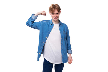 young man with red hair in a blue shirt over a white t-shirt with a mockup for advertising