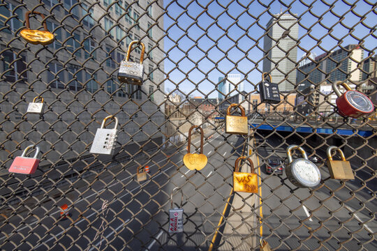 sweetheart padlocks on fence overlooking hi way