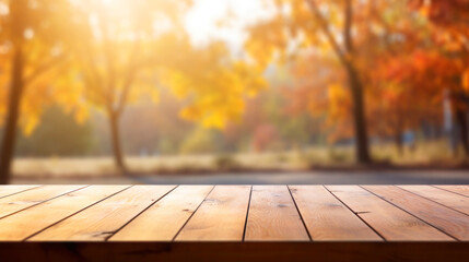Naklejka na ściany i meble Empty wooden table top and blurred autumn landscape as background for display your product