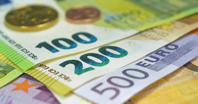 Banknotes 100, 200, 500 and 50 Euro and metal coins. Euro banknotes of various denominations. Real euro money of various colors and nominals and Euro cents. Cinema 4K 60fps video