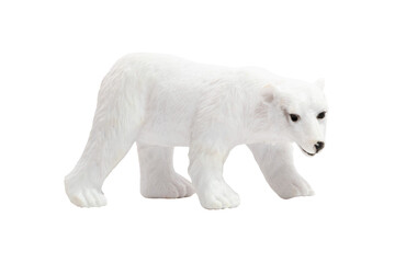 An isolated toy polar bear walking on all fours in profile. Wild animals concept.