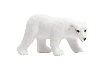 An isolated toy polar bear walking on all fours in profile. Wild animals concept.
