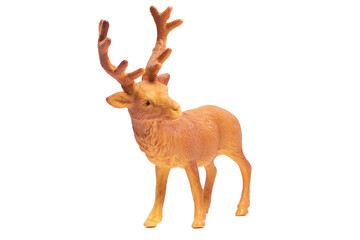 An isolated plastic orange deer toy. Wild animals concept.