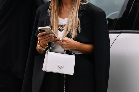 Milan, Italy - September 21, 2023: fashioner wearing Prada shoulder bag. Fashion blogger outfit details, street style