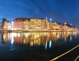 Fototapeta na wymiar Beautiful historic city center of Lucerne with famous buildings and promanade during night..