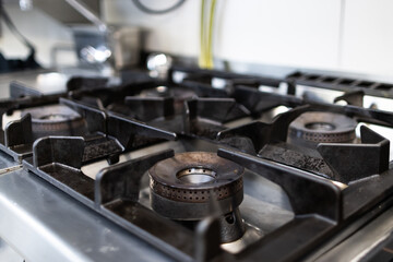 Focused photo of a restaurant kitchen stove before service begins