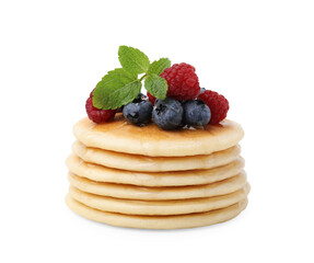 Delicious pancakes with berries, honey and mint isolated on white