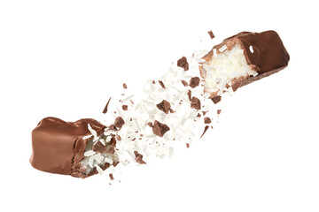 Broken chocolate bar with shredded coconut in air on white background - obrazy, fototapety, plakaty