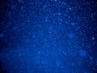 Abstract background, blur, bokeh, raindrops, blue background.