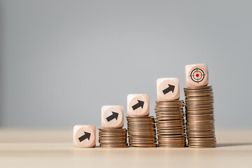Financial growth goals, Stacked money coins with percentage icon on wooden block for finance and business growth concept, financial investment.