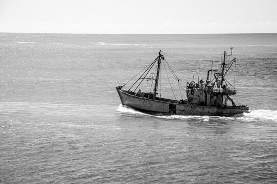 Black and white image of a Trawler fishing vessel, leaving the Port of Mar del Plata, Argentina.