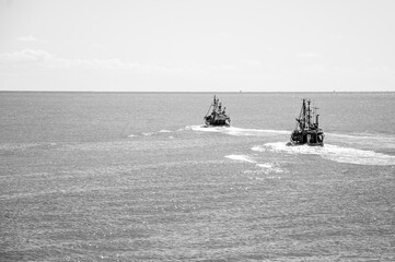 Two small Trawler fishing vessels, sailing in the Atlantic Ocean